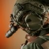 Close-up of a tactical helmet with night vision gear, showcasing modern military technology.